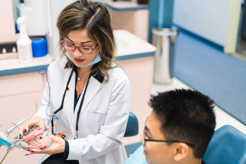 Dr. Christianne Lee discussing oral hygiene with a patient at Irvine Dentistry