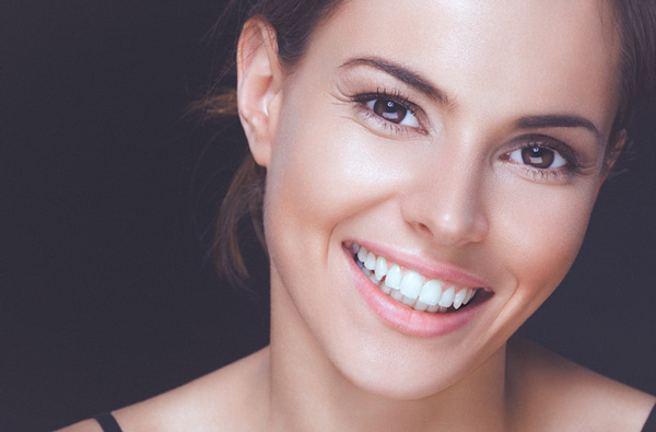 Woman smiling with perfect teeth Irvine Dentistry.